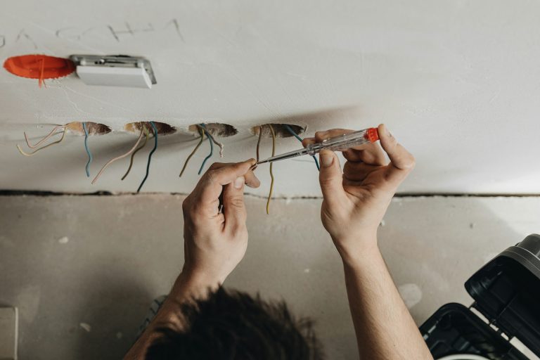 electrician fixing outlet